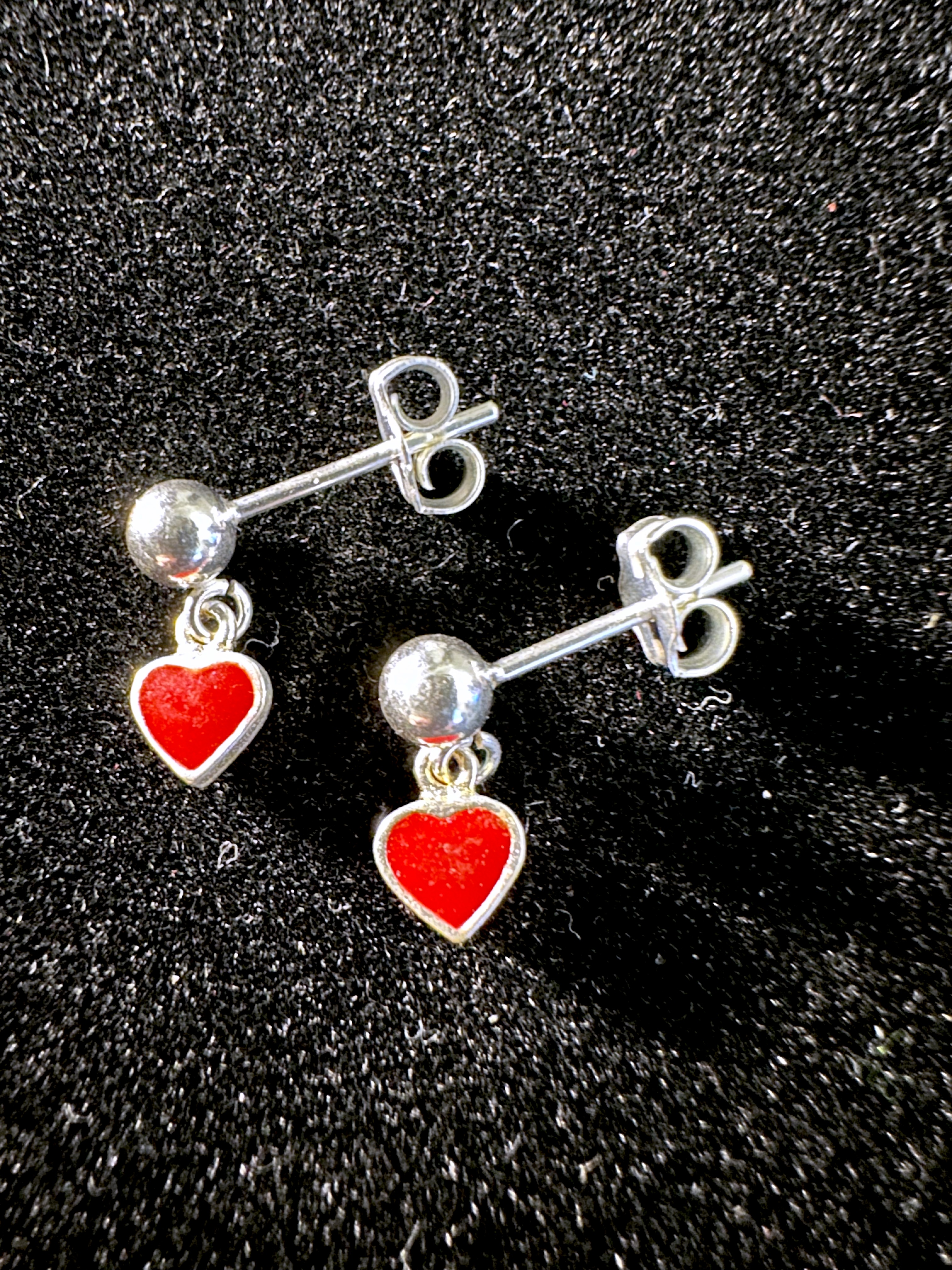 Earrings on black background