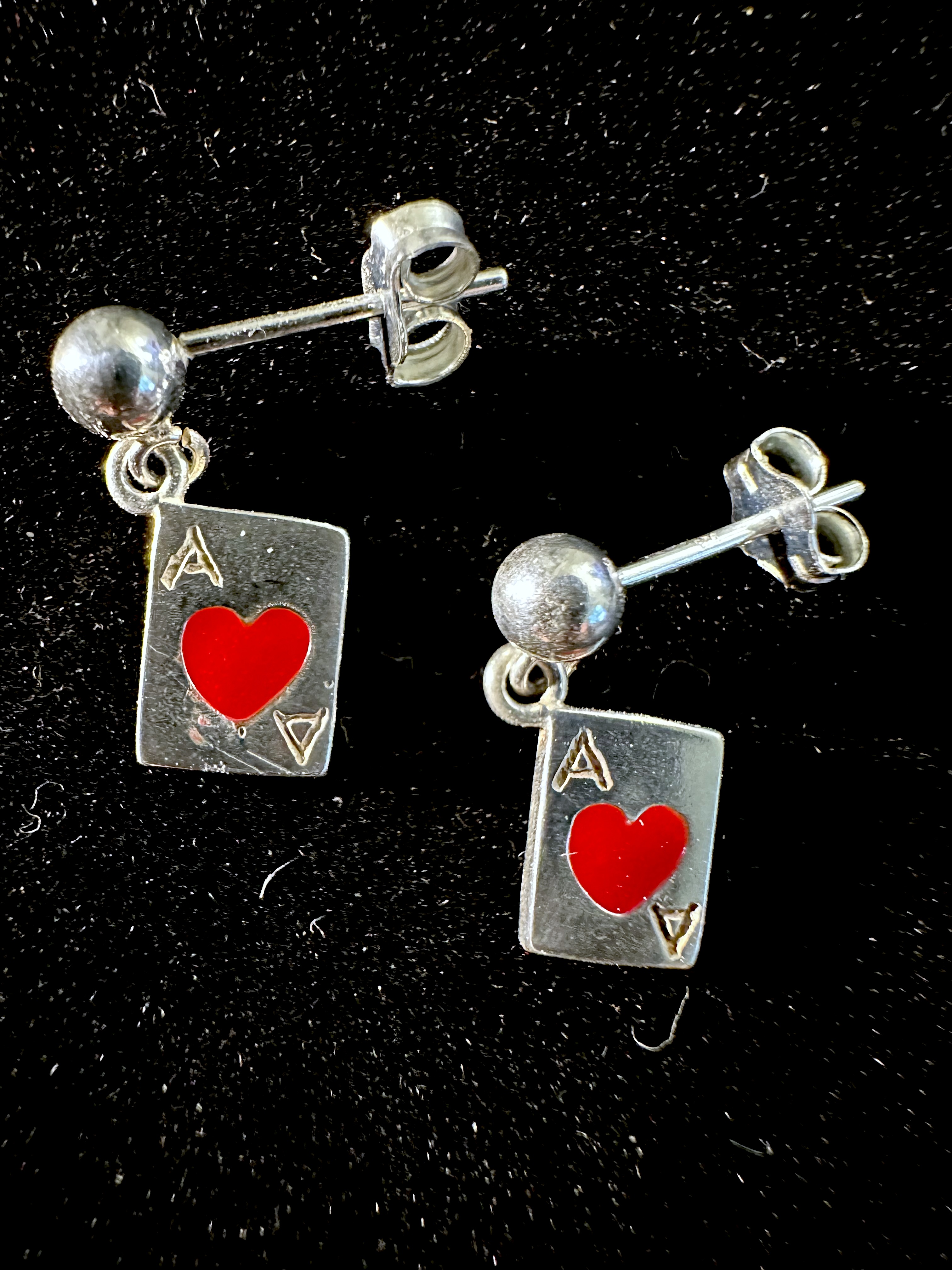 Earrings on black background