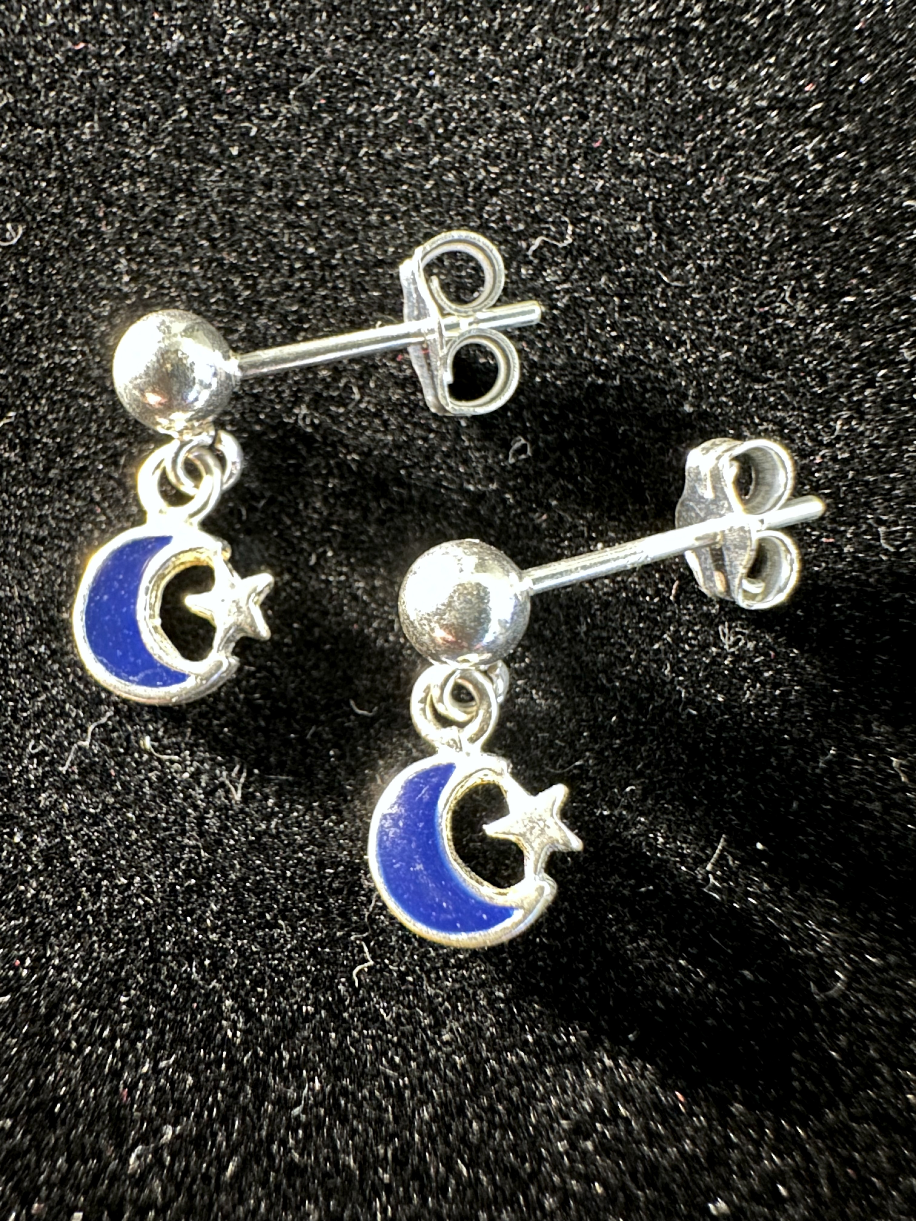 Earrings on black background