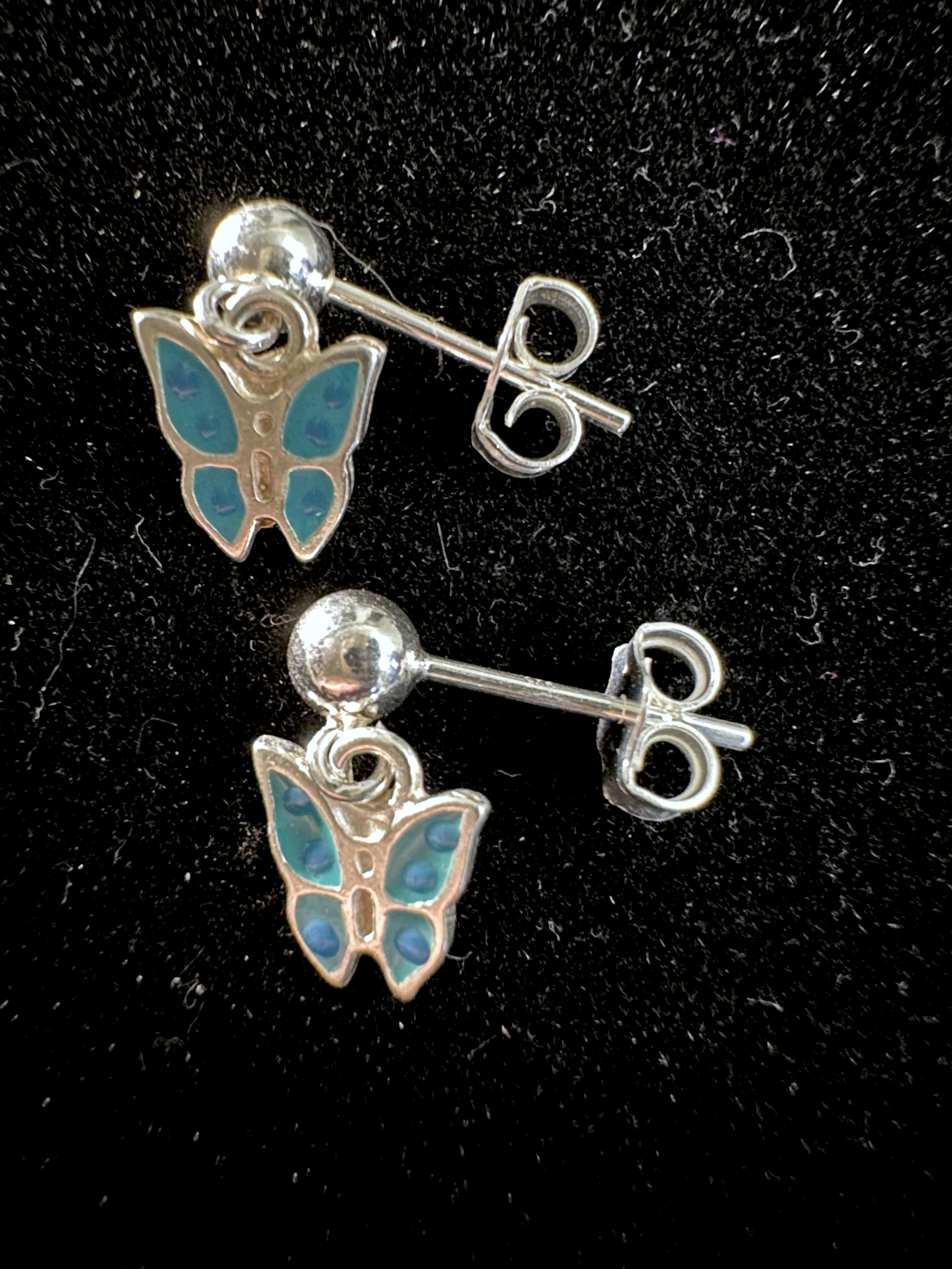 Earrings on black background