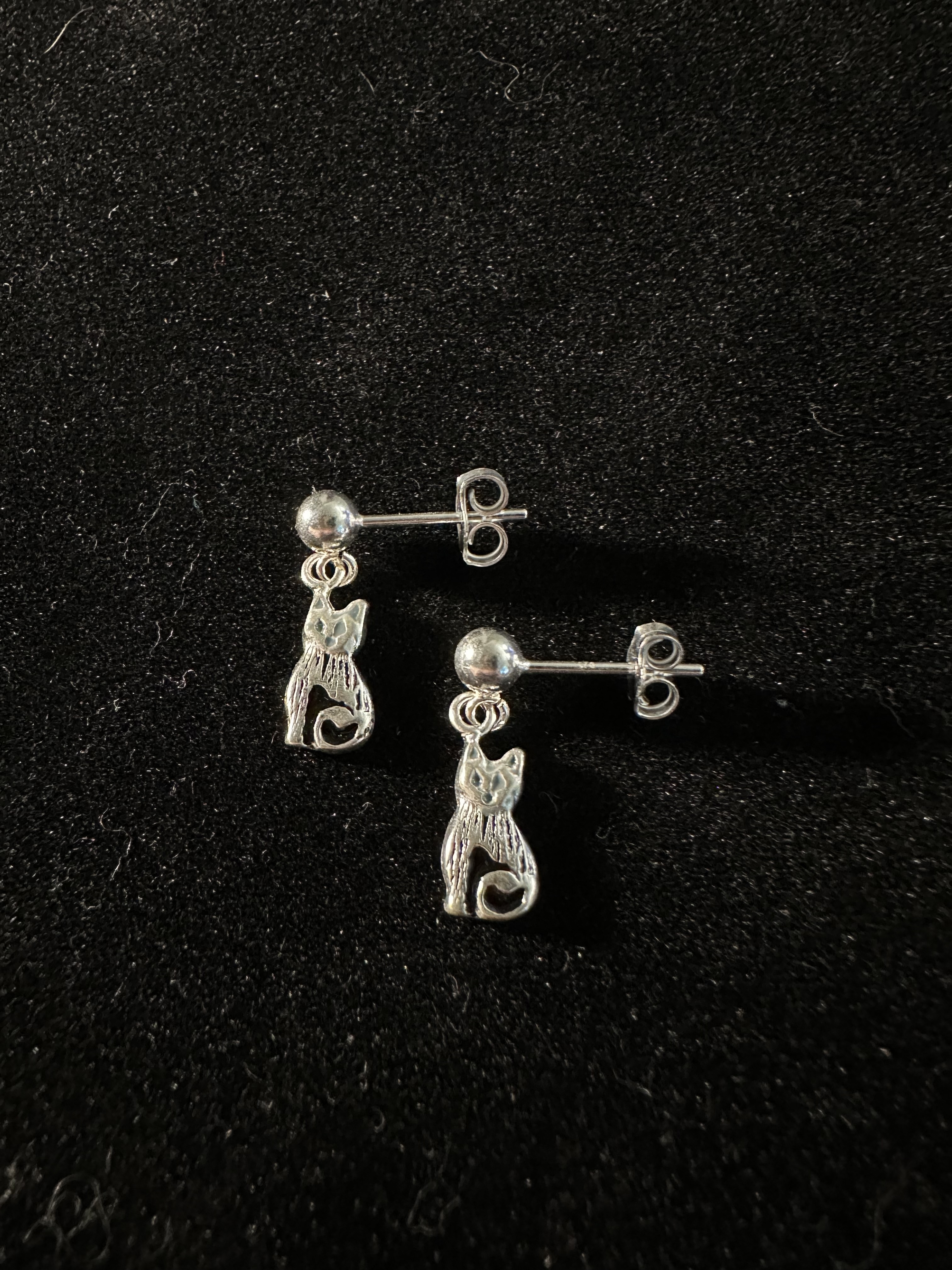 Earrings on black background