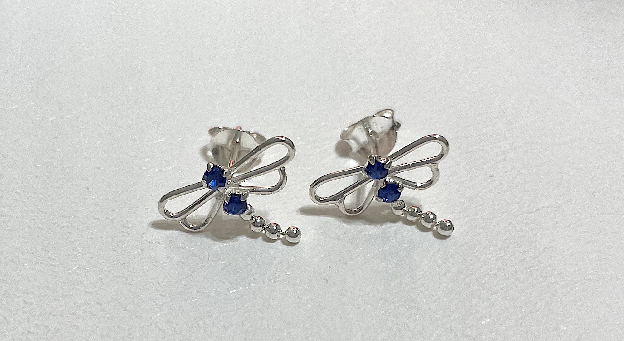 Earrings on white background