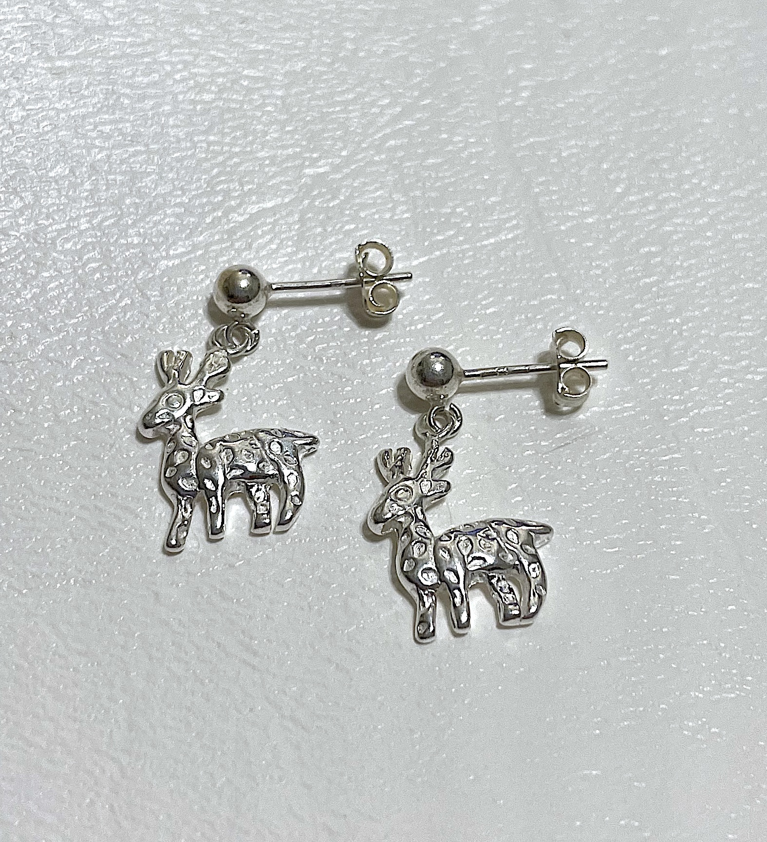 Earrings on white background