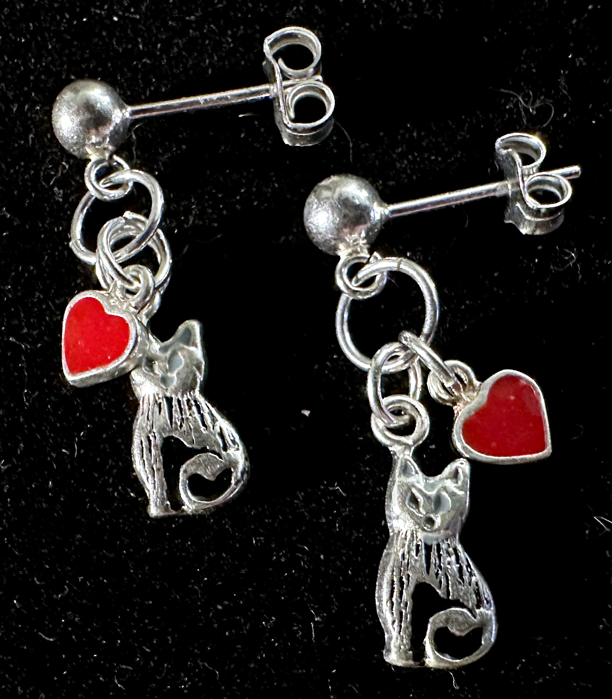 Earrings on black background