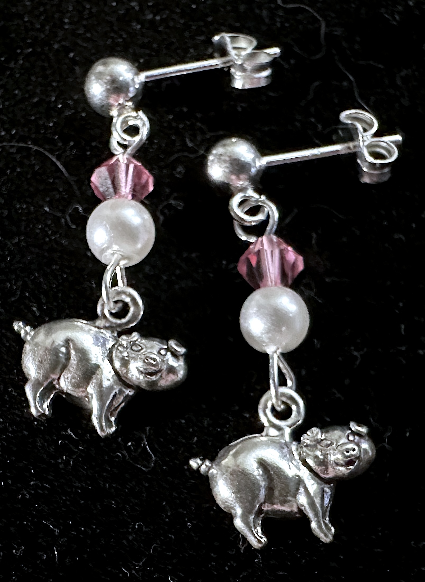 Earrings on black background