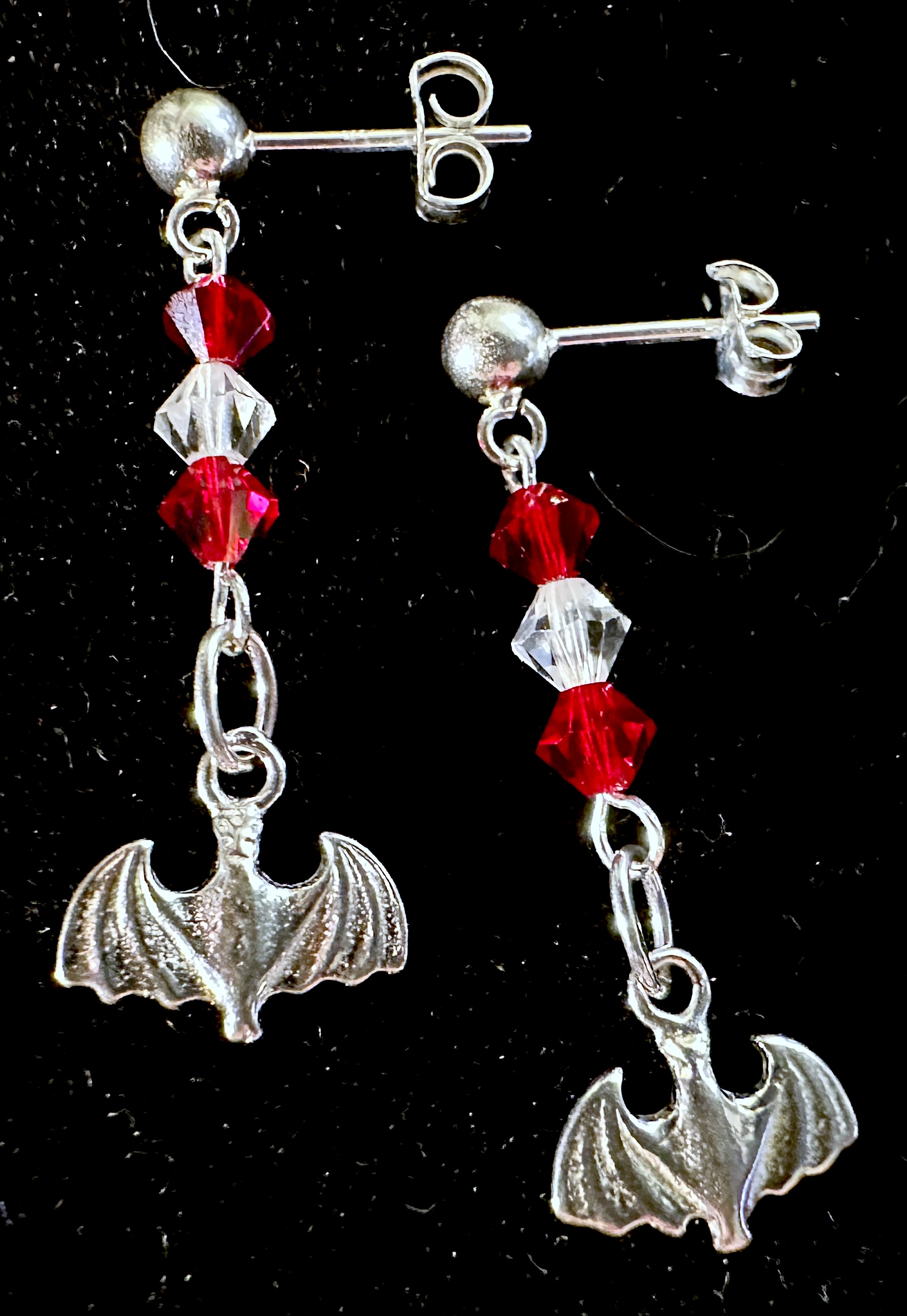 Earrings on black background